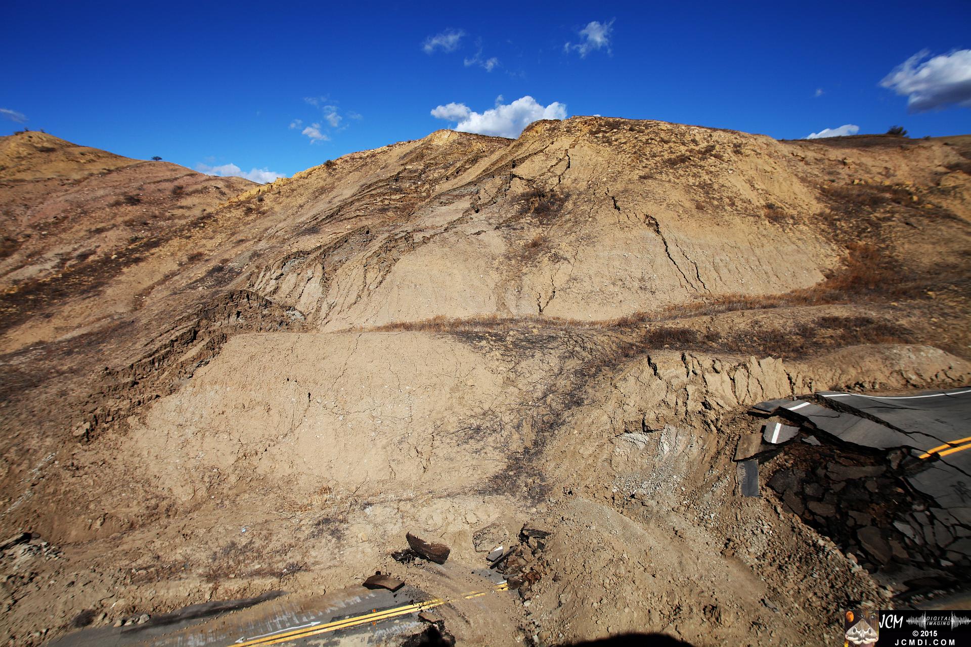 Landslide, buckled pavement, and terrain at Vasquez Canyon Road in Santa Clarita, CA filmed 11-25-2015